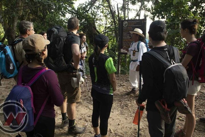 indigenous guide explaining lost city trek